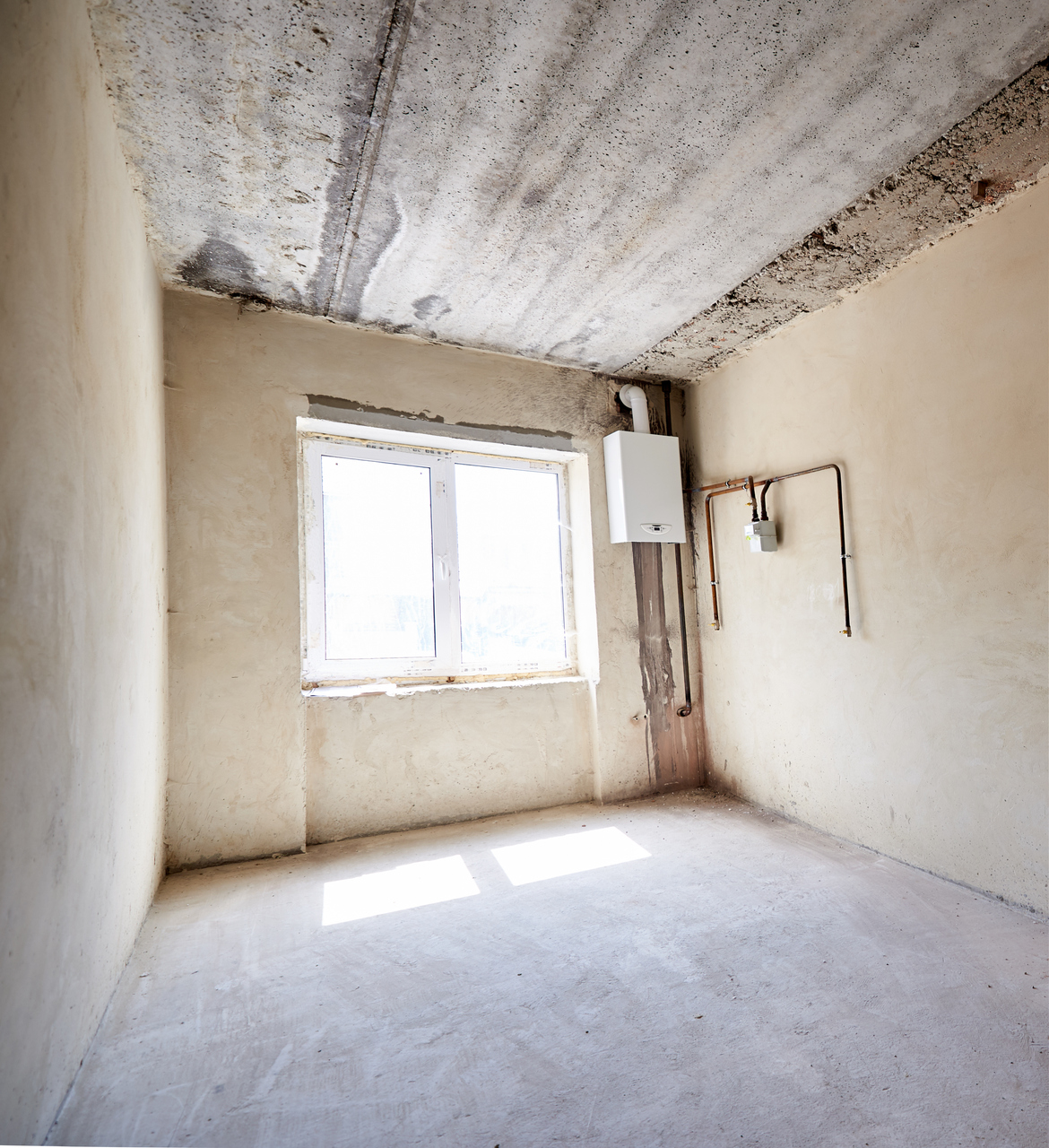 Unfinished room with natural light by 911 Property Services